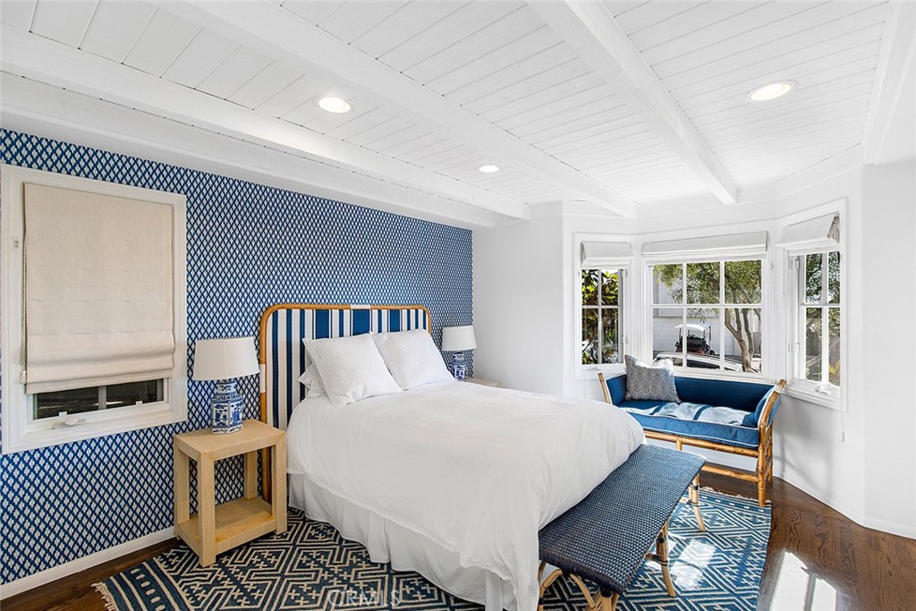 806 Emerald Bay Laguna Beach, CA 92651 - Photo 17 of 33 a bedroom with a large bed and a window