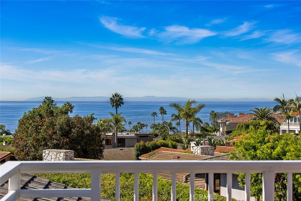 806 Emerald Bay Laguna Beach, CA 92651 - Photo 2 of 33 a view of a city with flower plants and wooden fence