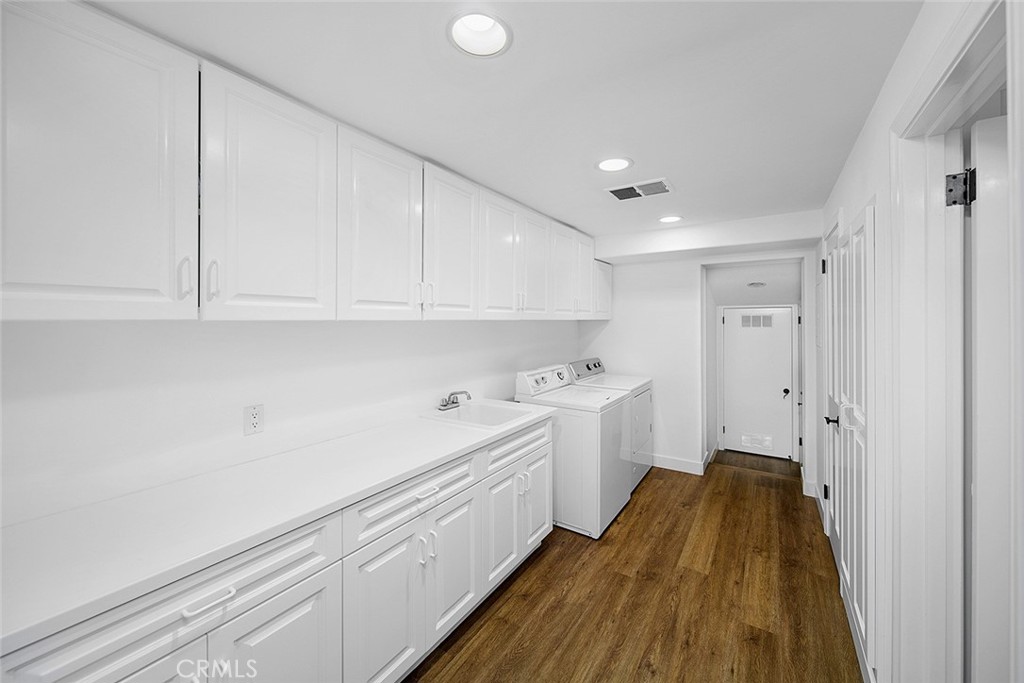 806 Emerald Bay Laguna Beach, CA 92651 - Photo 29 of 33 a kitchen with a sink and cabinets