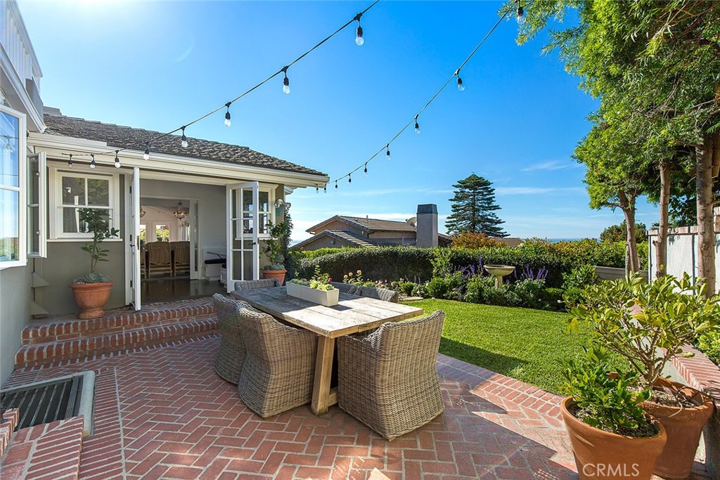 806 Emerald Bay Laguna Beach, CA 92651 - Photo 4 of 33 a view of a patio with couches table and chairs and potted plants