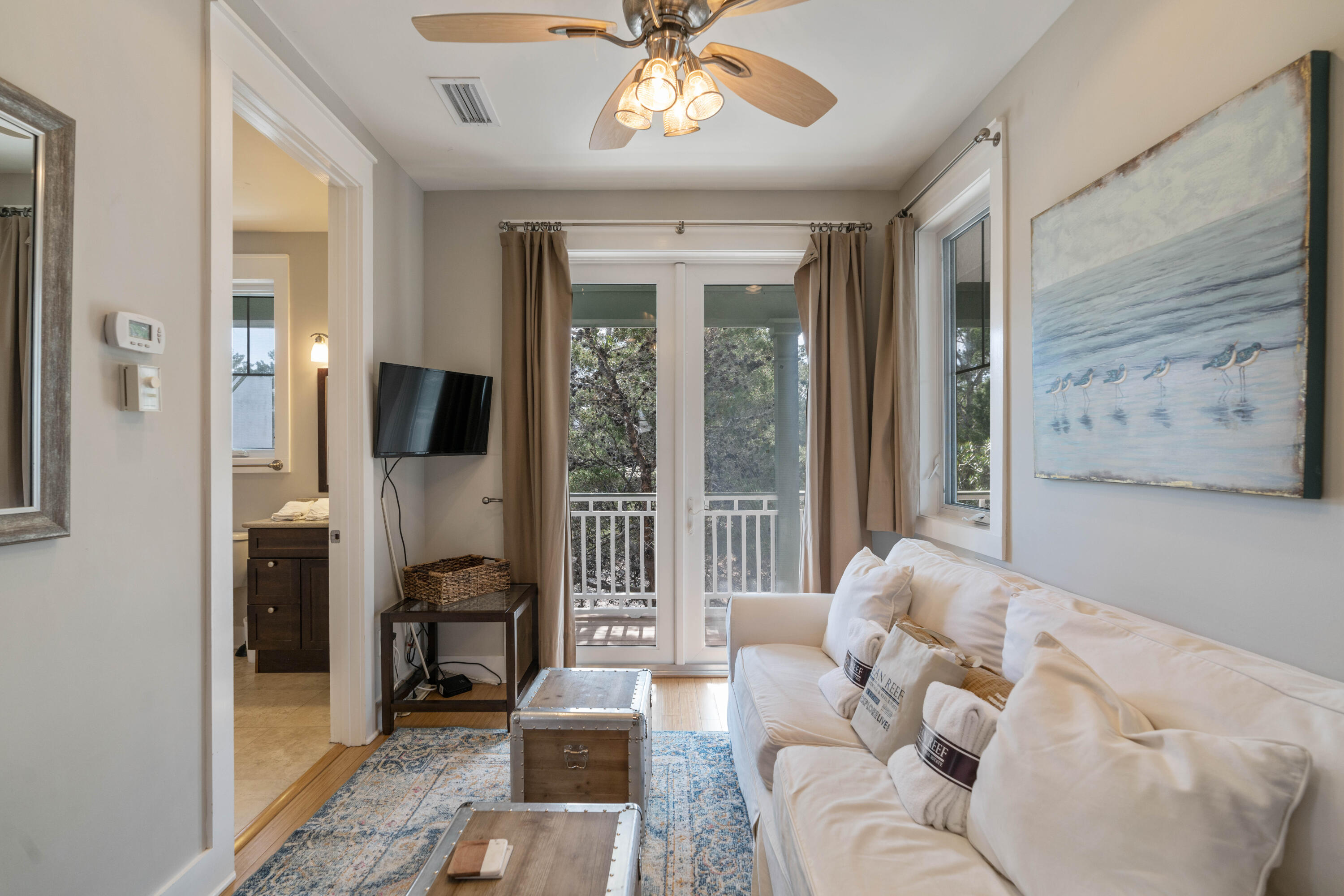 90 West Cobia Run Inlet Beach, FL 32461 - Photo 25 of 37 a living room with furniture and a flat screen tv