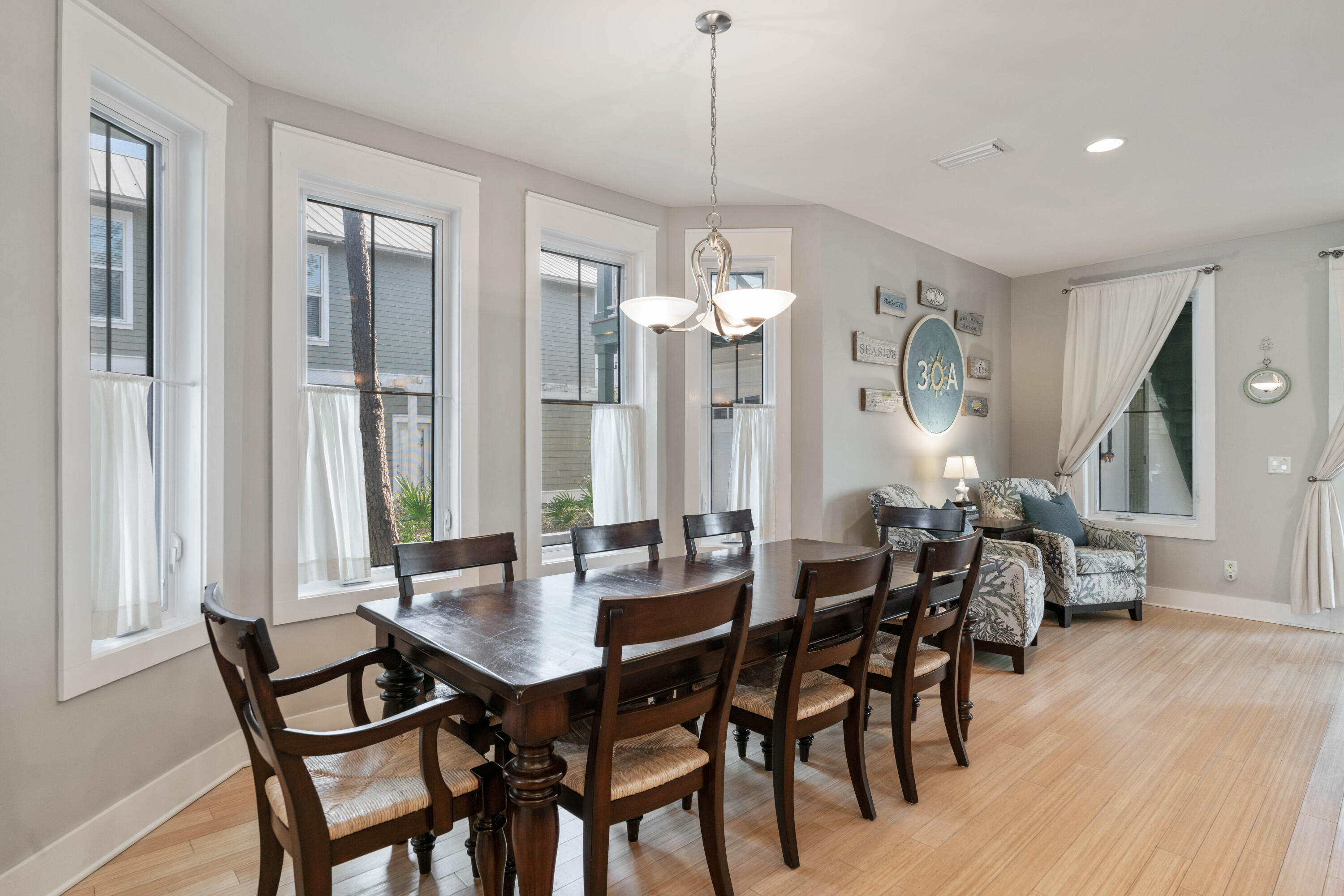 90 West Cobia Run Inlet Beach, FL 32461 - Photo 8 of 37 a view of a dining room with furniture and wooden floor