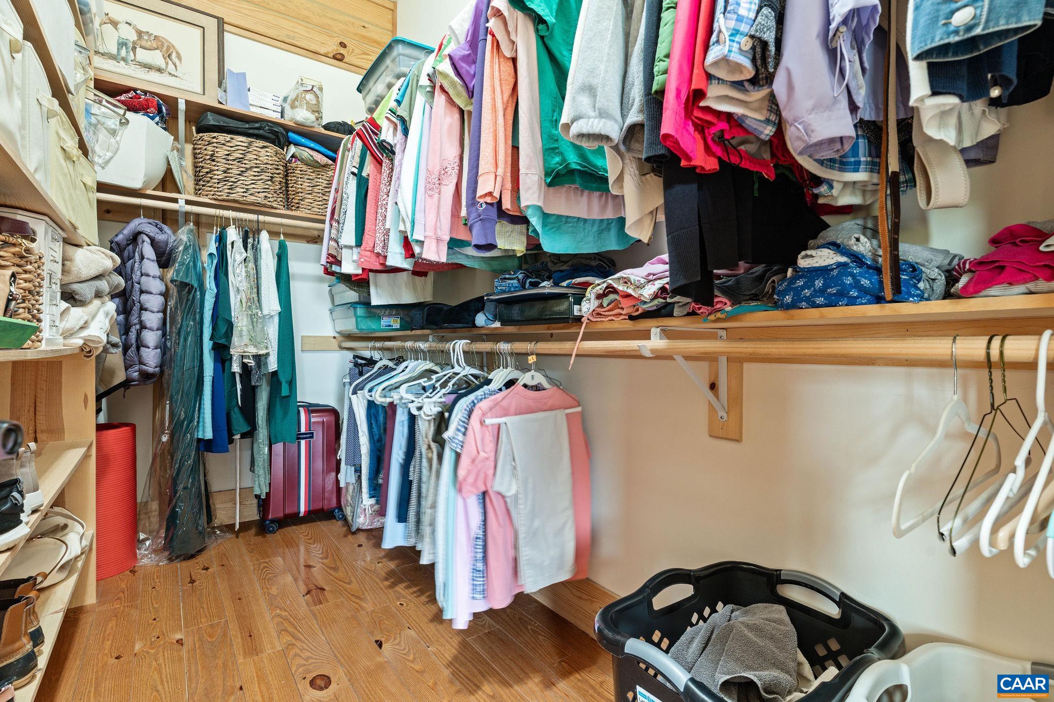 42 River Ridge Lane Stanardsville, VA 22973 - Photo 34 of 70 a view of walk in closet with clothes and shoes