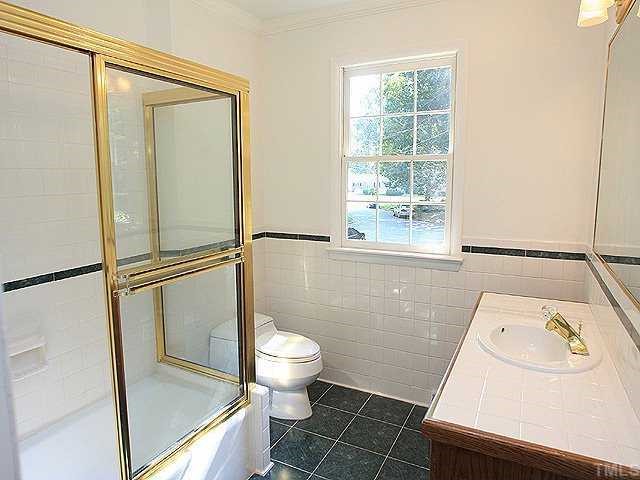 4001 Brevard Place Raleigh, NC 27609 - Photo 7 of 12 a bathroom with a sink and a vanity