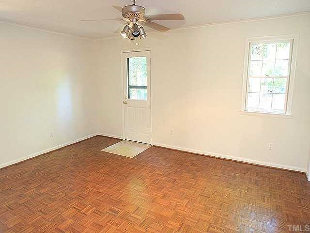 4001 Brevard Place Raleigh, NC 27609 - Photo 8 of 12 an empty room with windows and fan