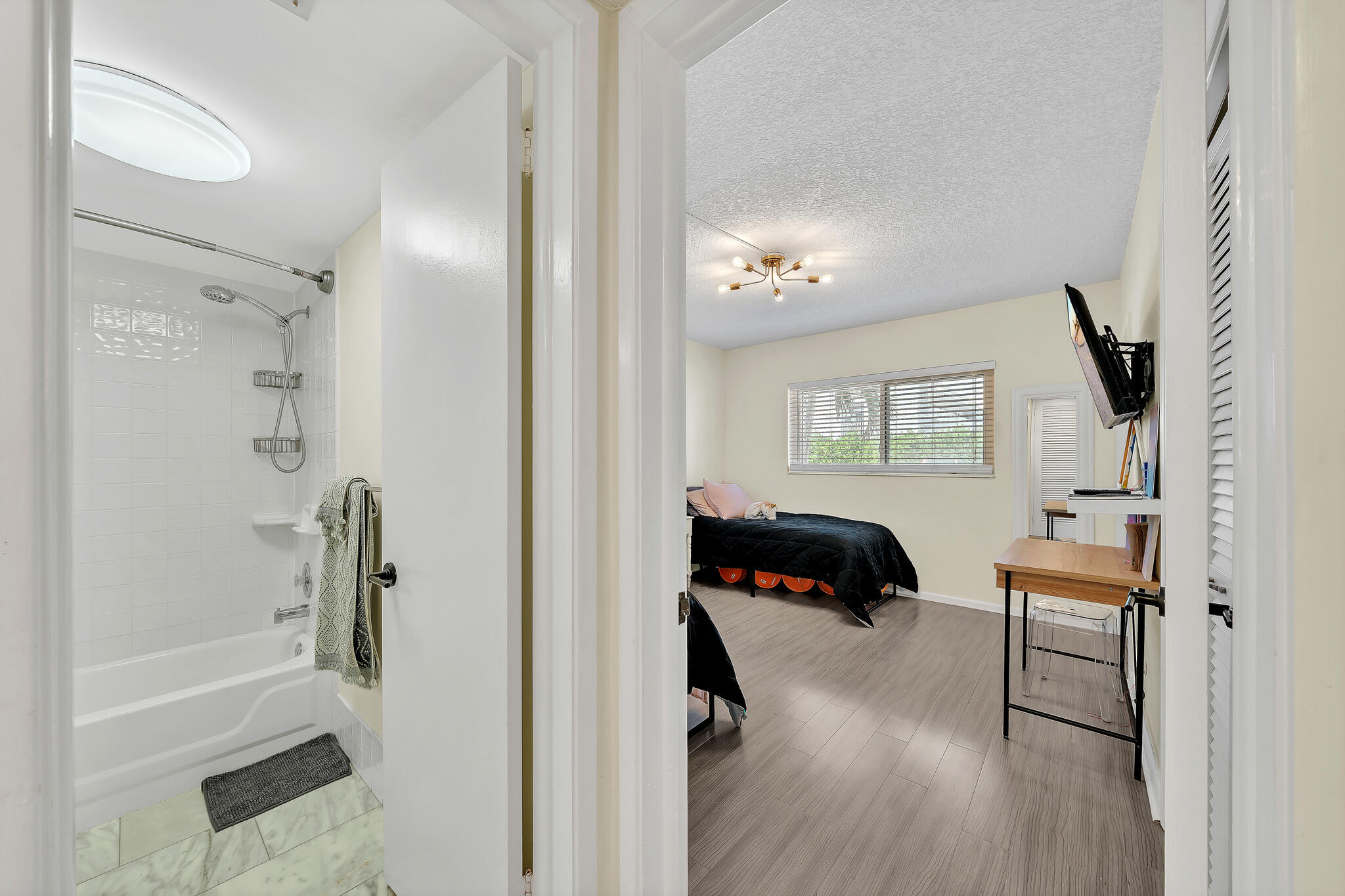 711 Northeast Harbour Terrace, Unit 3090 Boca Raton, FL 33431 - Photo 11 of 53 a bedroom with a bed and a window