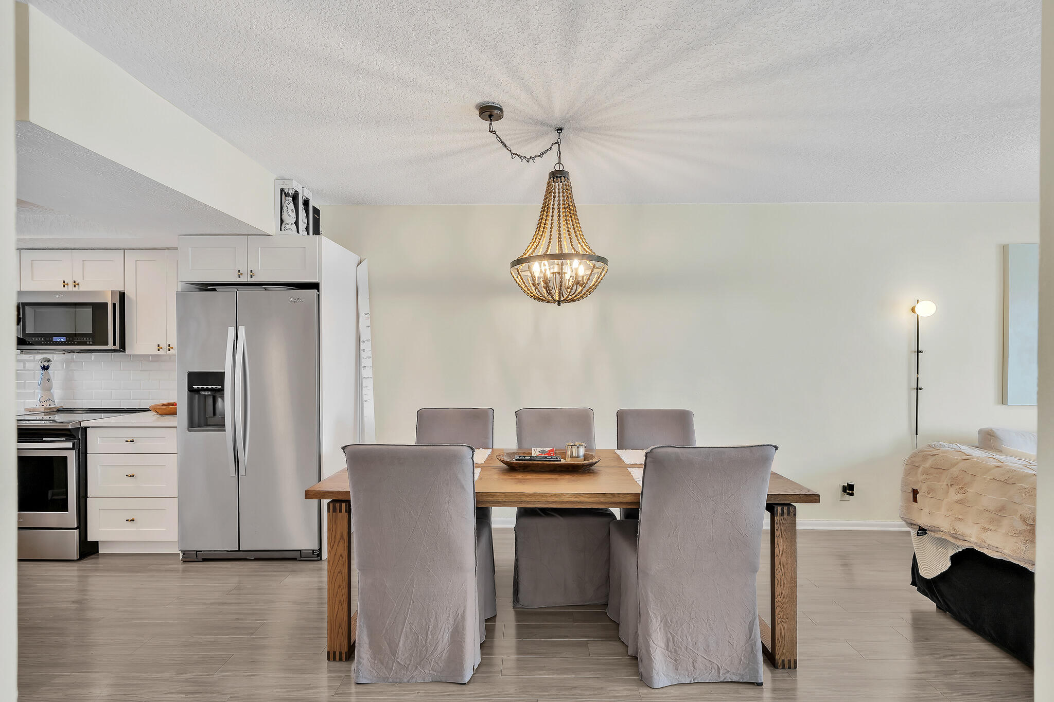 711 Northeast Harbour Terrace, Unit 3090 Boca Raton, FL 33431 - Photo 18 of 53 a view of kitchen with sink refrigerator dining table and chairs