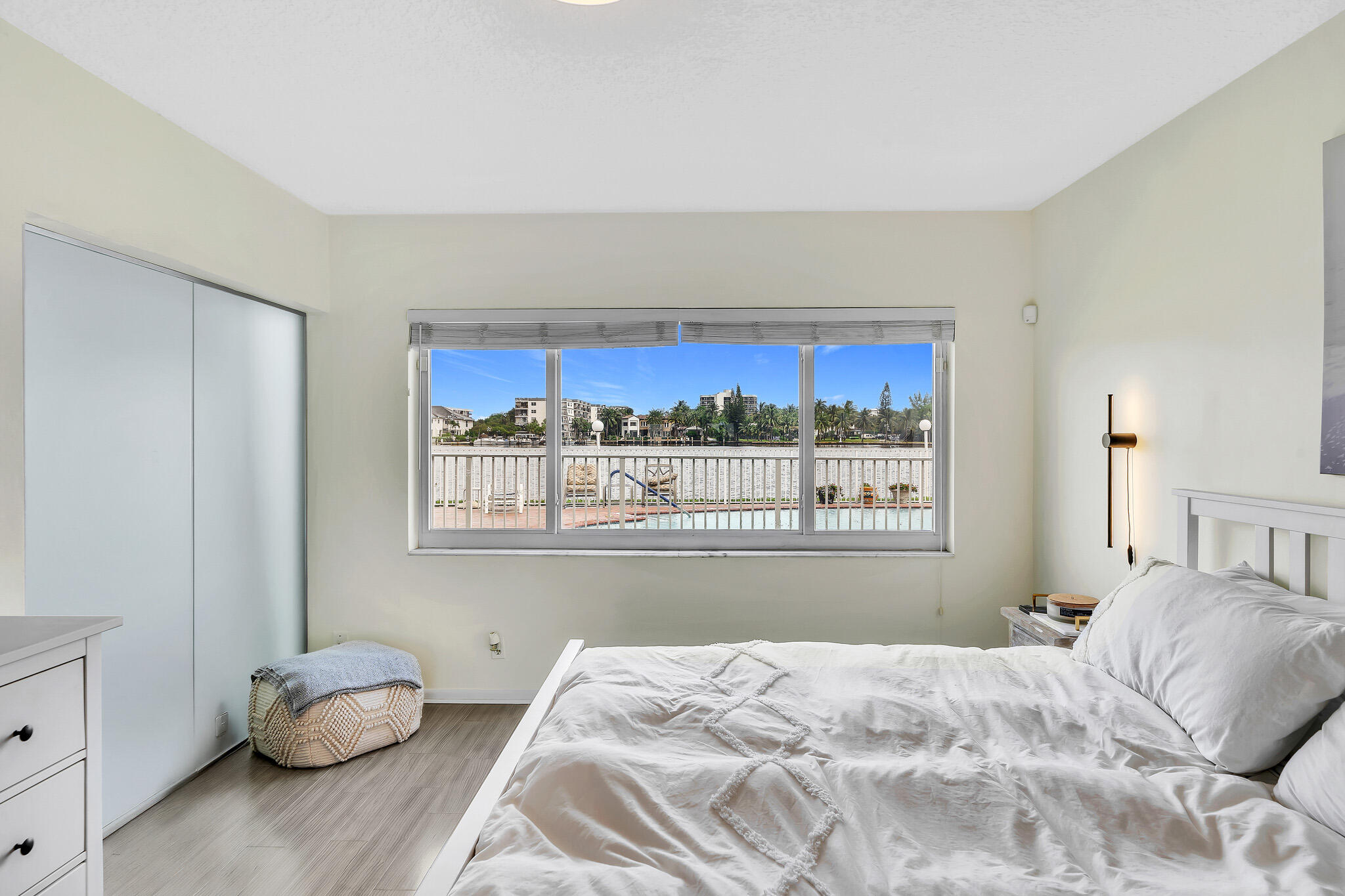 711 Northeast Harbour Terrace, Unit 3090 Boca Raton, FL 33431 - Photo 25 of 53 a bedroom with a bed and window