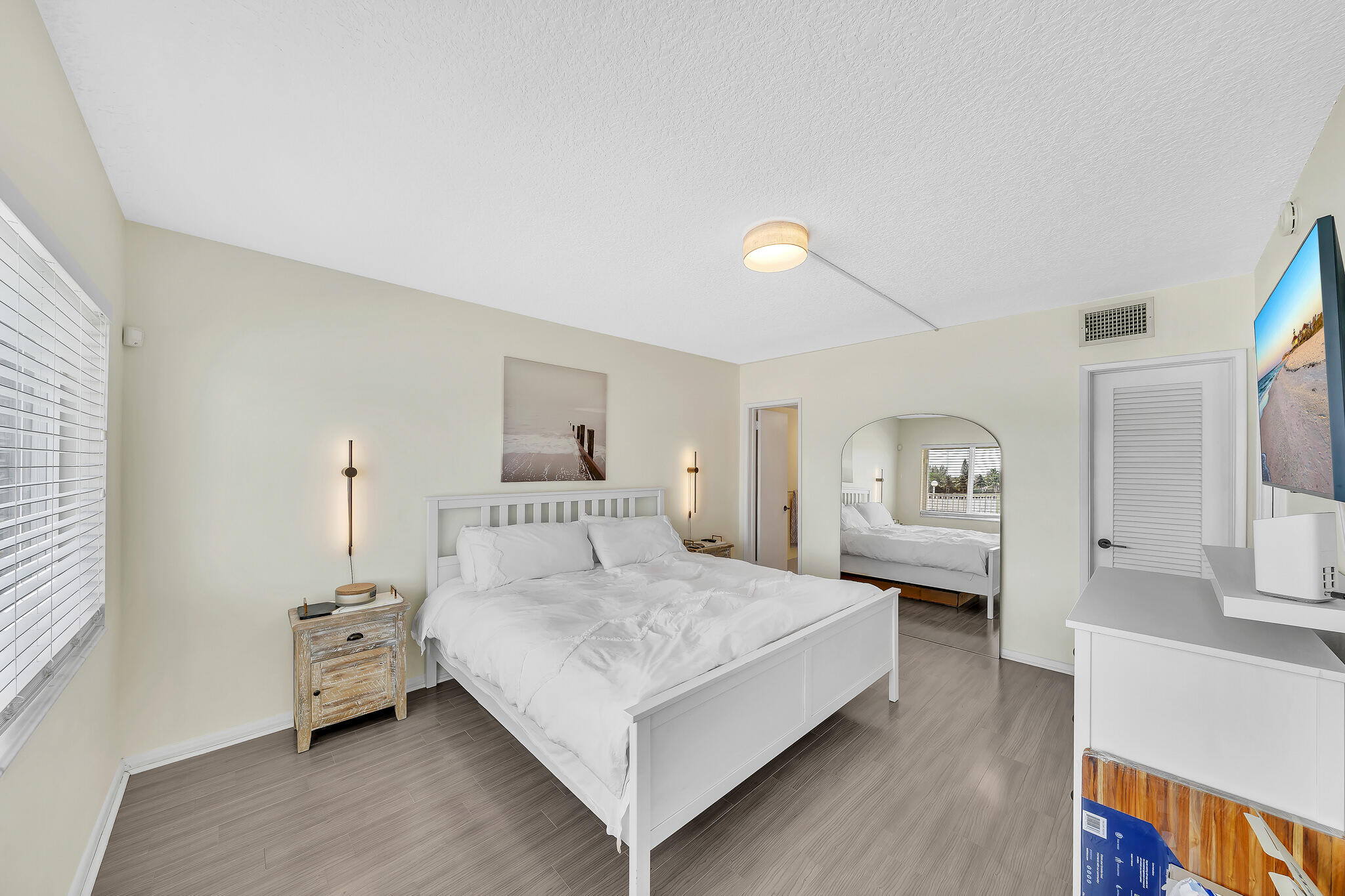 711 Northeast Harbour Terrace, Unit 3090 Boca Raton, FL 33431 - Photo 29 of 53 a bedroom with a bed and a view of kitchen