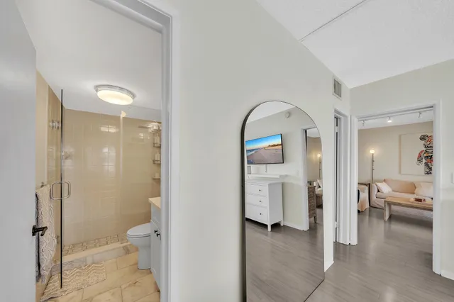 a view of a livingroom with furniture wooden floor and window