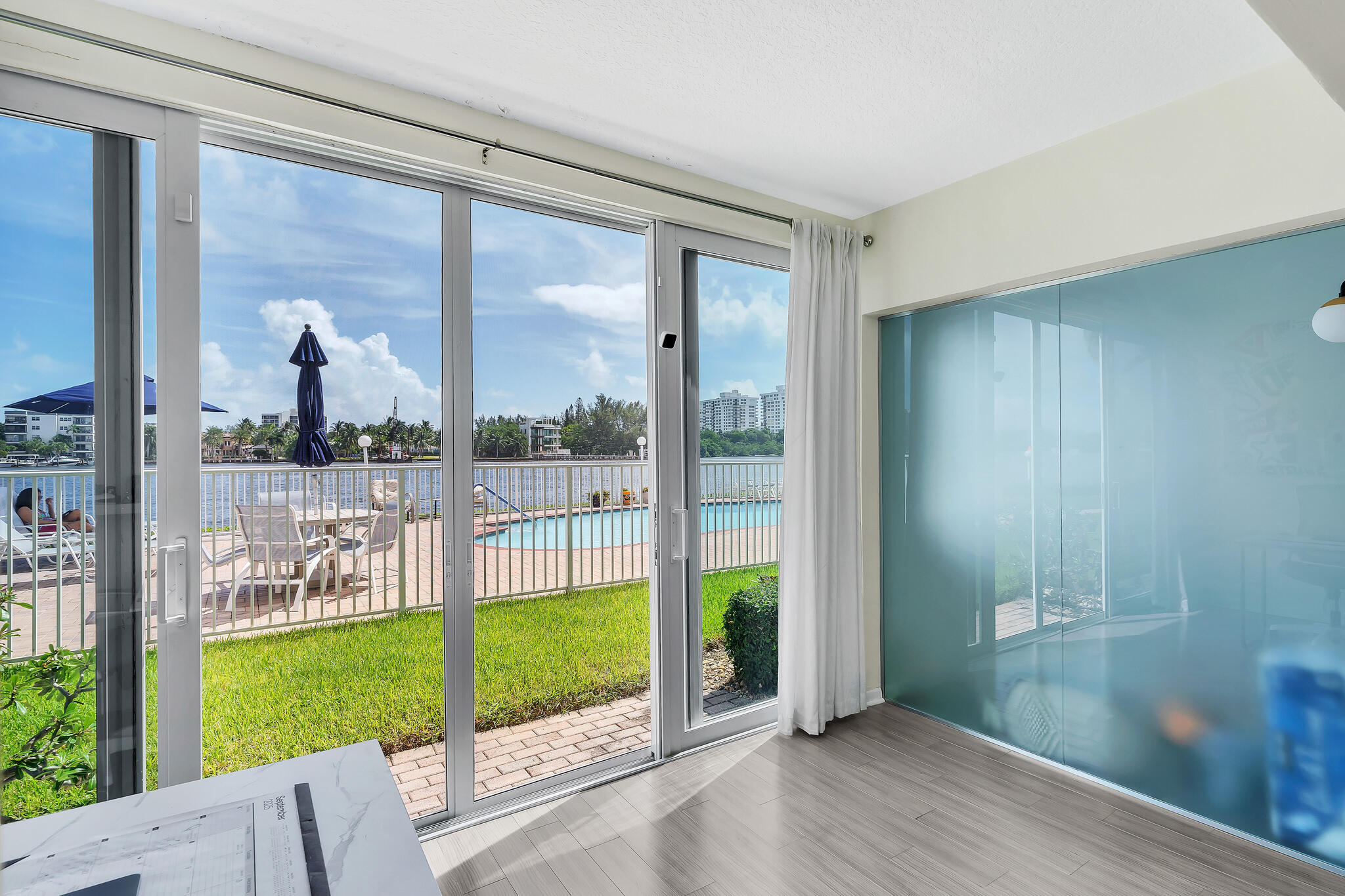 711 Northeast Harbour Terrace, Unit 3090 Boca Raton, FL 33431 - Photo 35 of 53 a view of a porch with a backyard