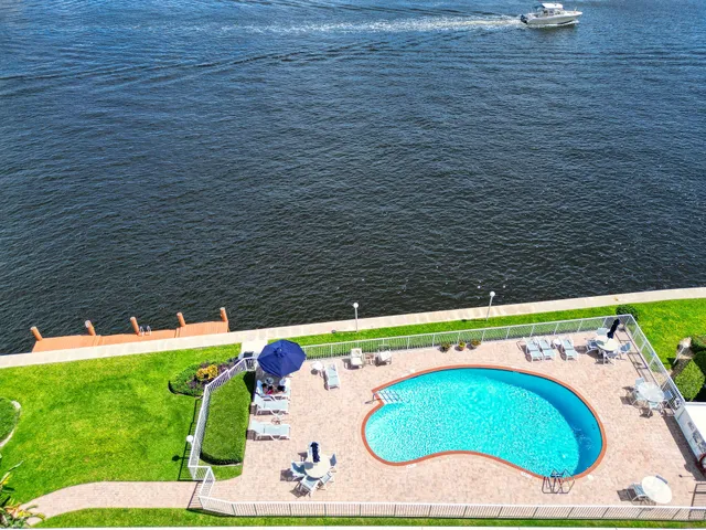 an aerial view of a swimming pool and mountain view