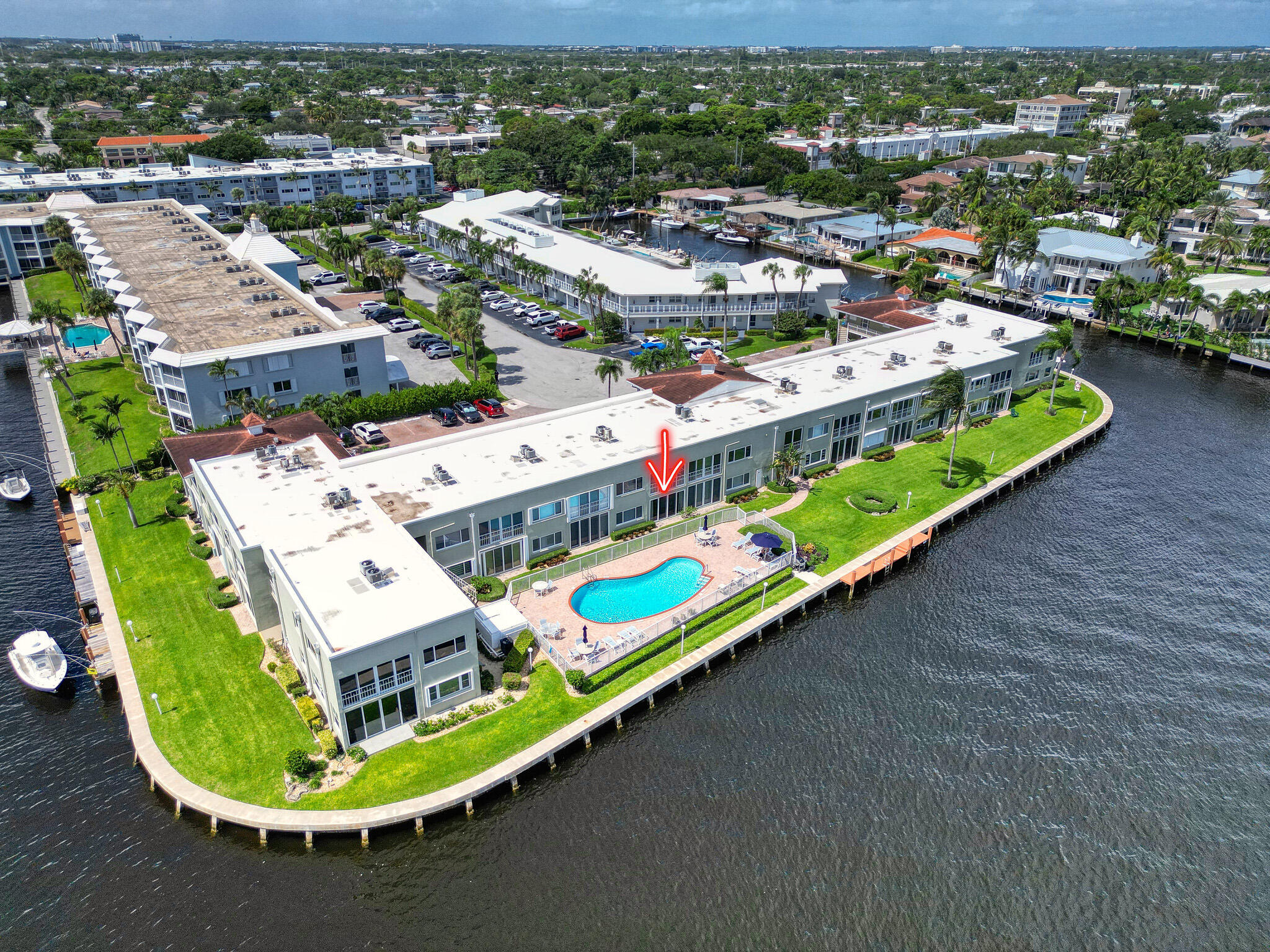 711 Northeast Harbour Terrace, Unit 3090 Boca Raton, FL 33431 - Photo 40 of 53 an aerial view of a swimming pool and mountain view