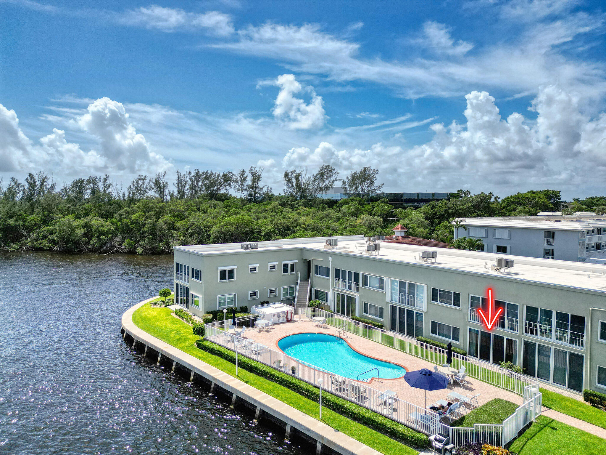 711 Northeast Harbour Terrace, Unit 3090 Boca Raton, FL 33431 - Photo 42 of 53 a view of a swimming pool with a patio