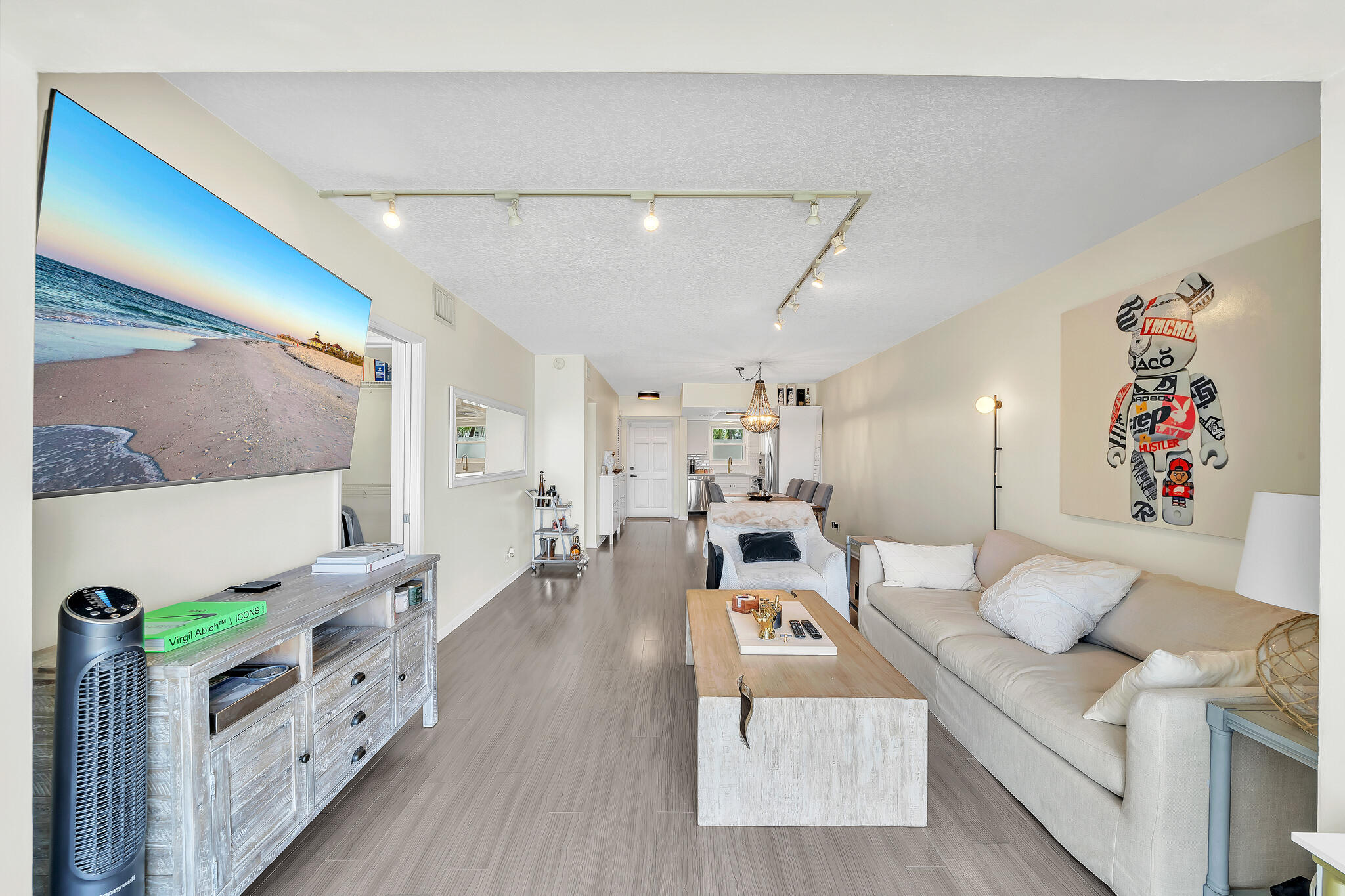 711 Northeast Harbour Terrace, Unit 3090 Boca Raton, FL 33431 - Photo 44 of 53 a living room with furniture and a table