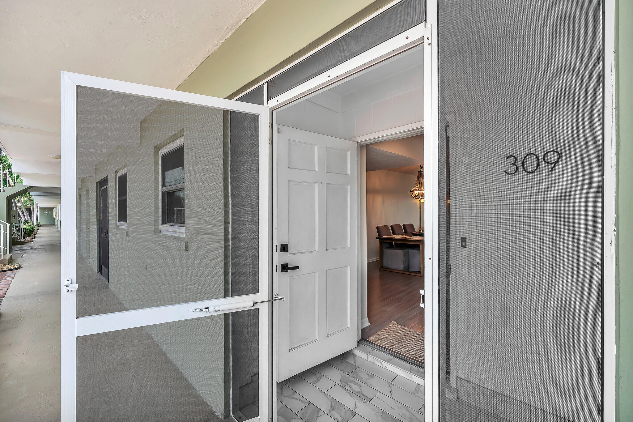 711 Northeast Harbour Terrace, Unit 3090 Boca Raton, FL 33431 - Photo 5 of 53 hallway with view of bathroom
