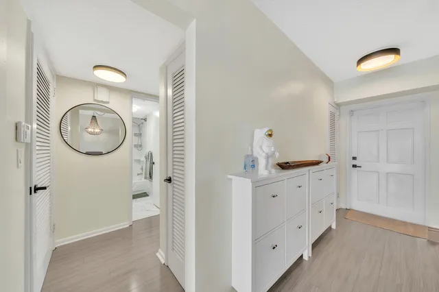 a view of a storage and utility room with washer and dryer
