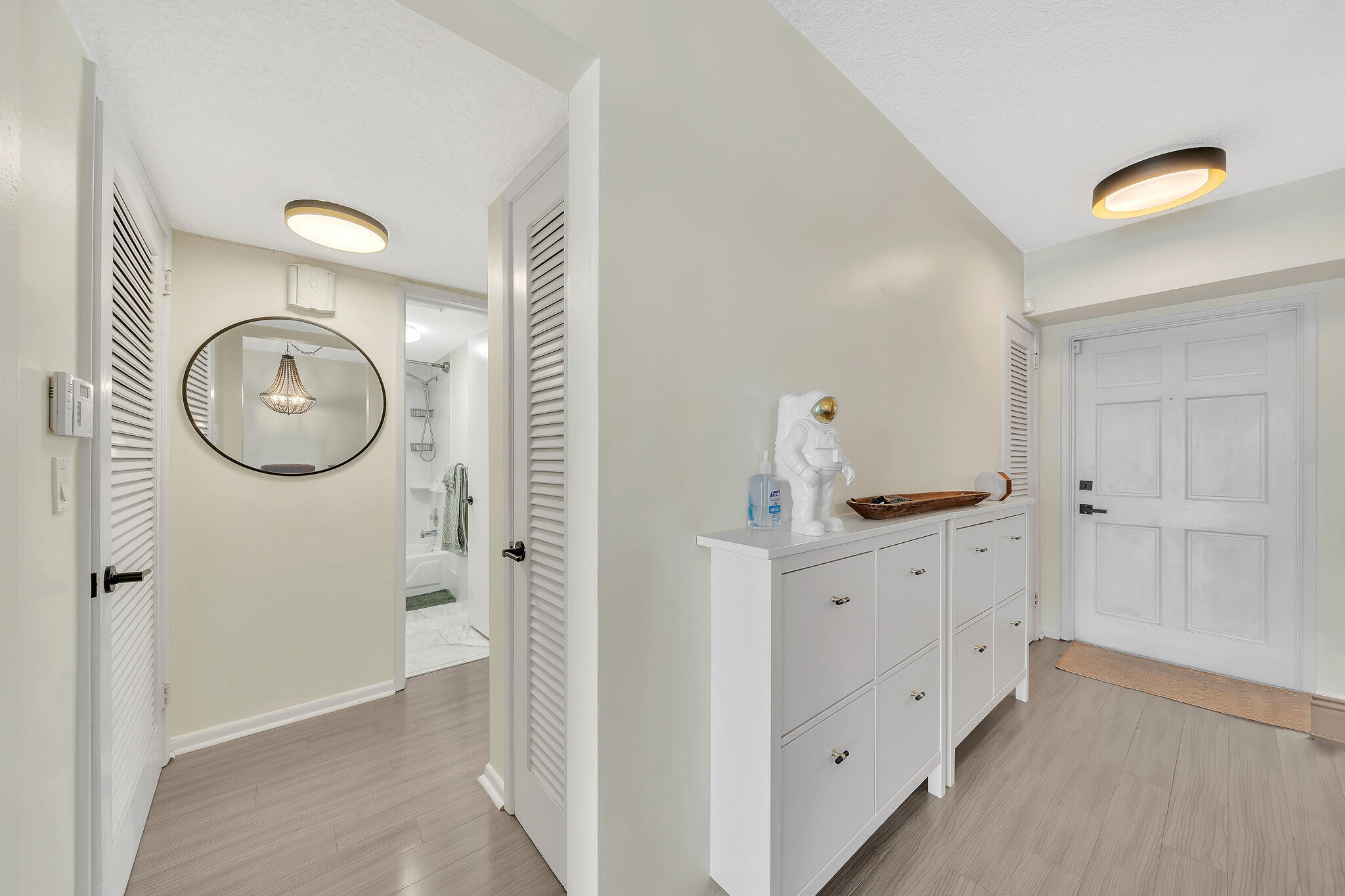 711 Northeast Harbour Terrace, Unit 3090 Boca Raton, FL 33431 - Photo 9 of 53 a bathroom with a granite countertop sink and a mirror