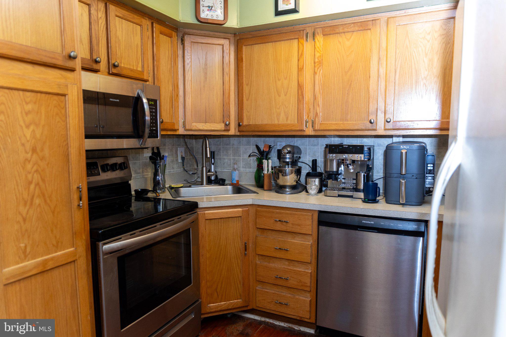 26 Plumtree Road Levittown, PA 19056 - Photo 4 of 16 Cozy kitchen with warm wood accents.