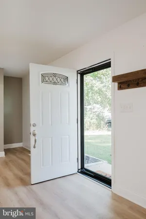 a view of front door with wooden floor