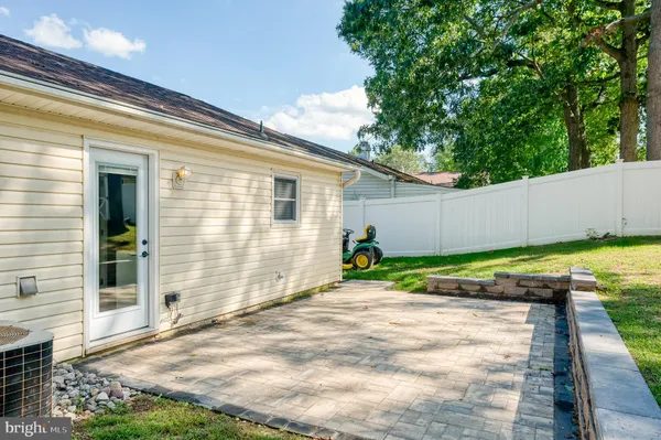 a view of a backyard with large trees