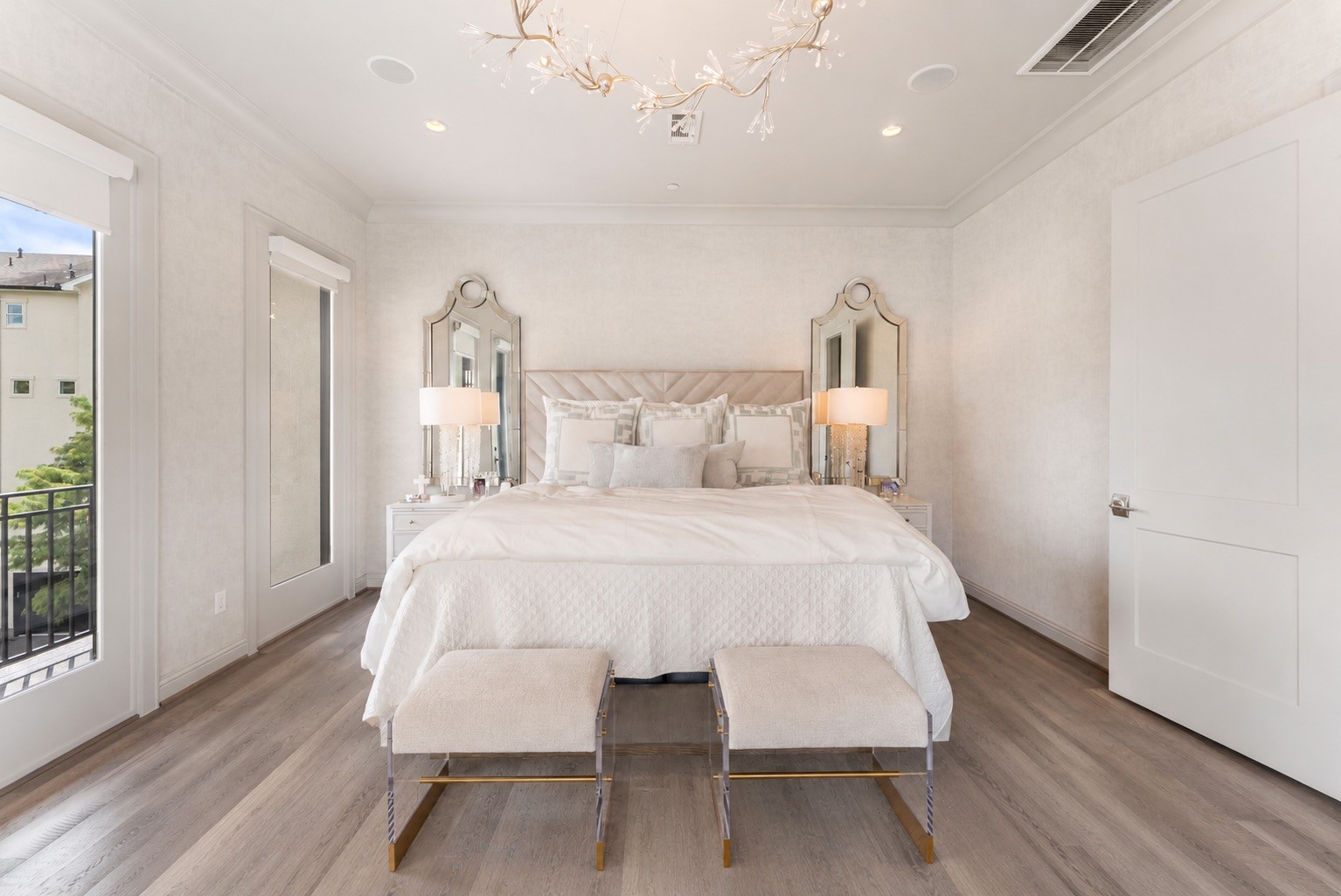 10 Nautical Terrace Way The Woodlands, TX 77380 - Photo 16 of 28 Serene primary retreat wrapped in luminous designer wallcovering, crowned by a sculptural branch chandelier, with direct access to a private balcony.