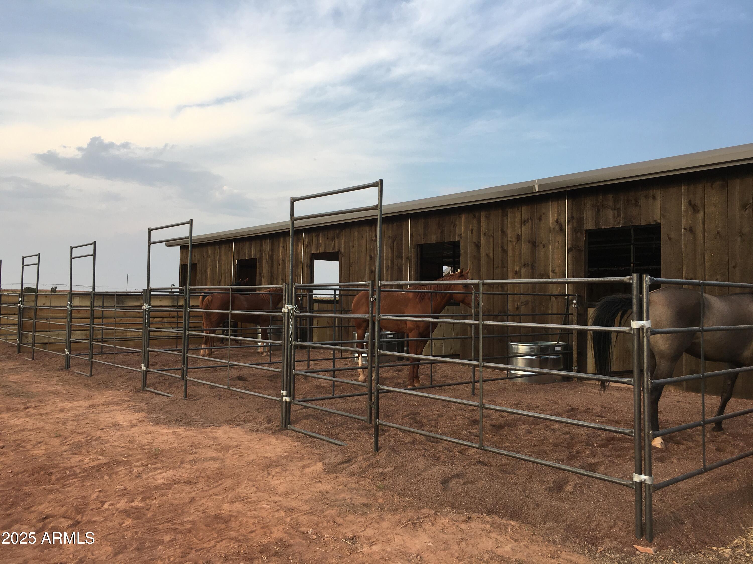 7545 East Sherwood Lane, Unit R Snowflake, AZ 85937 - Photo 3 of 6 a view of an empty room with wooden floor