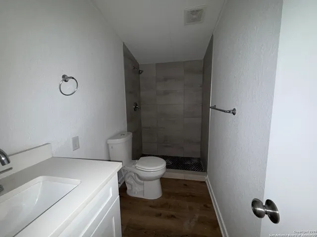 a bathroom with a toilet and a sink