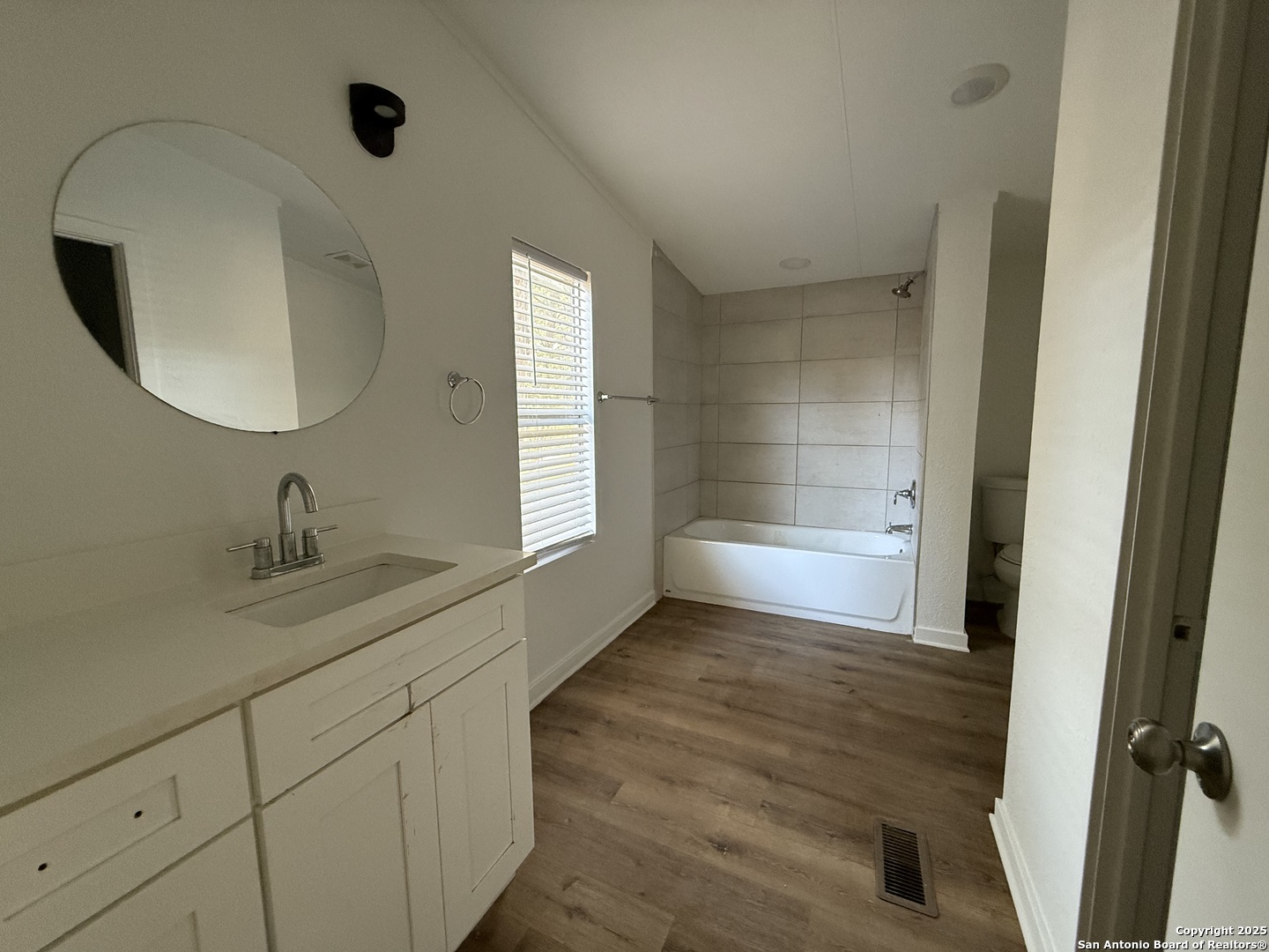 282 Flint Ridge Street Bastrop, TX 78602 - Photo 8 of 12 a bathroom with a sink and a mirror