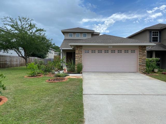 22 3rd Street Shalimar, FL 32579 - Photo 1 of 40 a front view of a house with garden