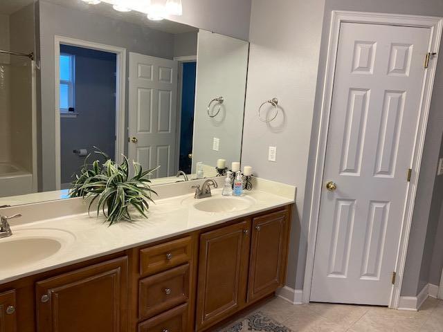 22 3rd Street Shalimar, FL 32579 - Photo 15 of 40 a bathroom with a double vanity sink and a mirror