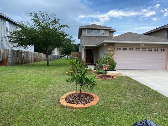 22 3rd Street Shalimar, FL 32579 - Photo 2 of 40 a view of a house with a yard fire pit and a fountain
