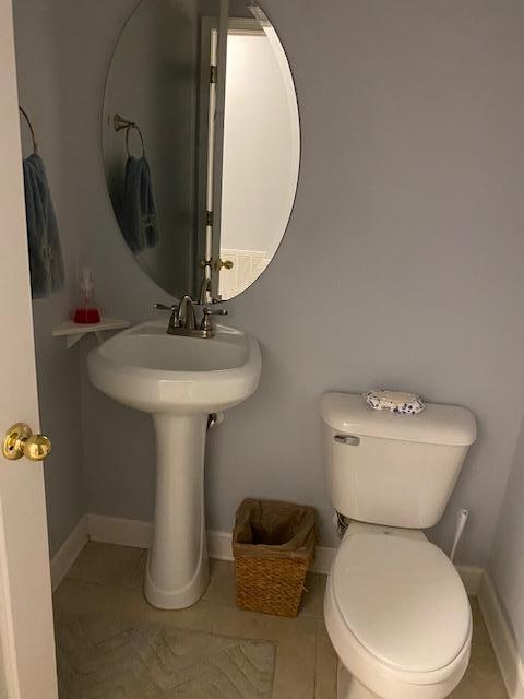 22 3rd Street Shalimar, FL 32579 - Photo 30 of 40 a bathroom with a toilet sink and mirror