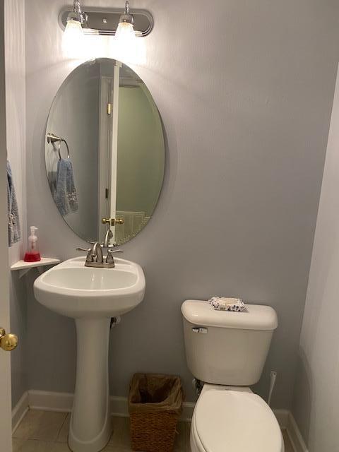 22 3rd Street Shalimar, FL 32579 - Photo 31 of 40 a bathroom with a toilet sink and mirror