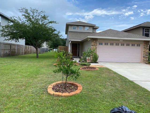 22 3rd Street Shalimar, FL 32579 - Photo 6 of 40 a front view of a house with a yard
