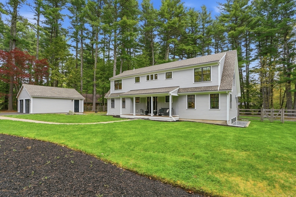 136 Holden Wood Road Concord, MA 01742 - Photo 31 of 31 a view of a house with a big yard potted plants and large tree