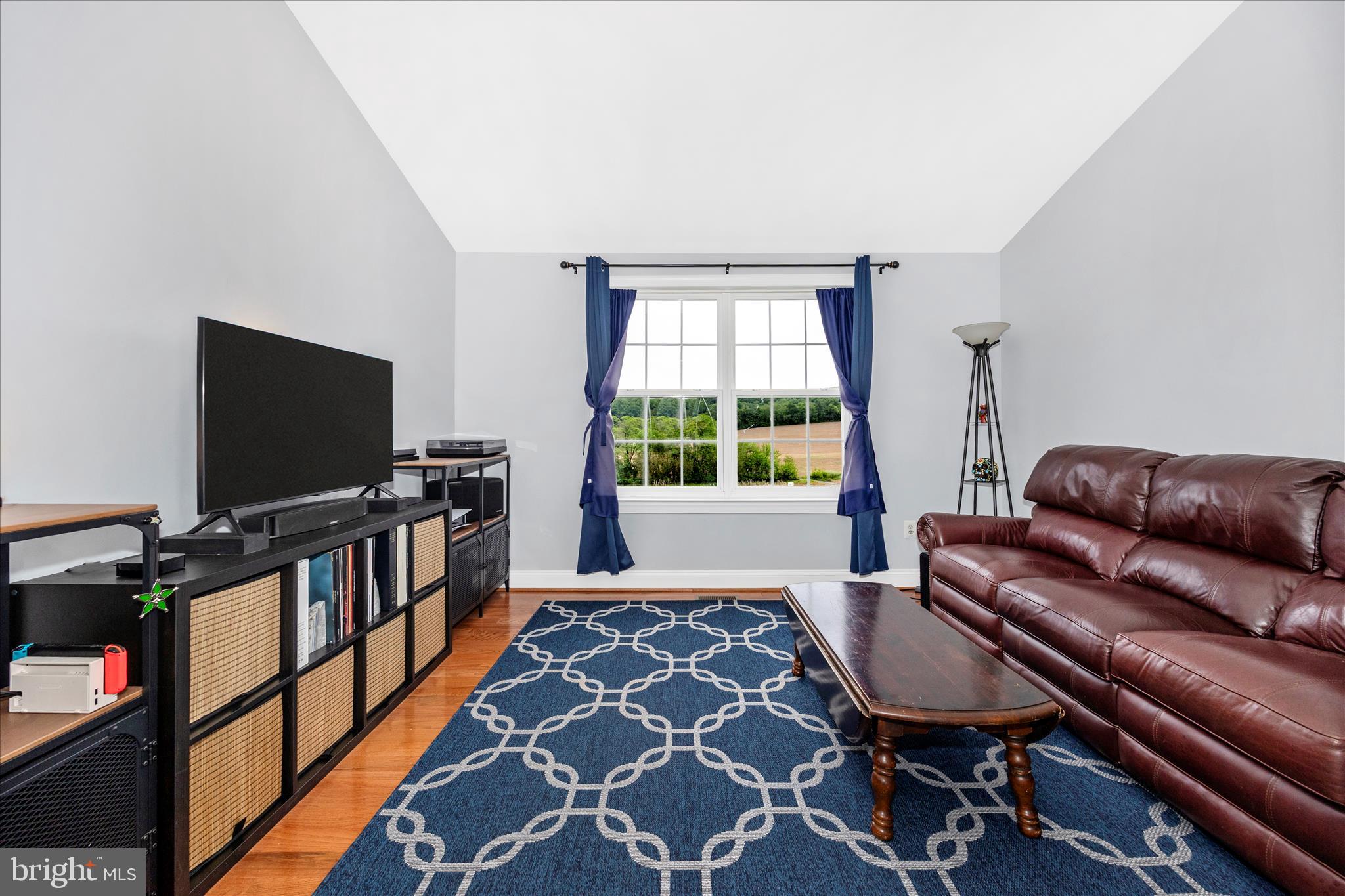 9855 McKinstry Mill Road New Windsor, MD 21776 - Photo 24 of 76 a living room with furniture and a flat screen tv