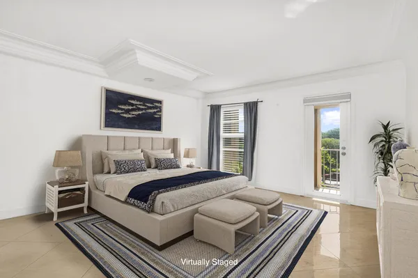 a bedroom with a bed wooden floor and window