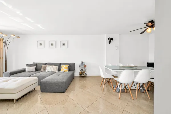 a living room with furniture and a table