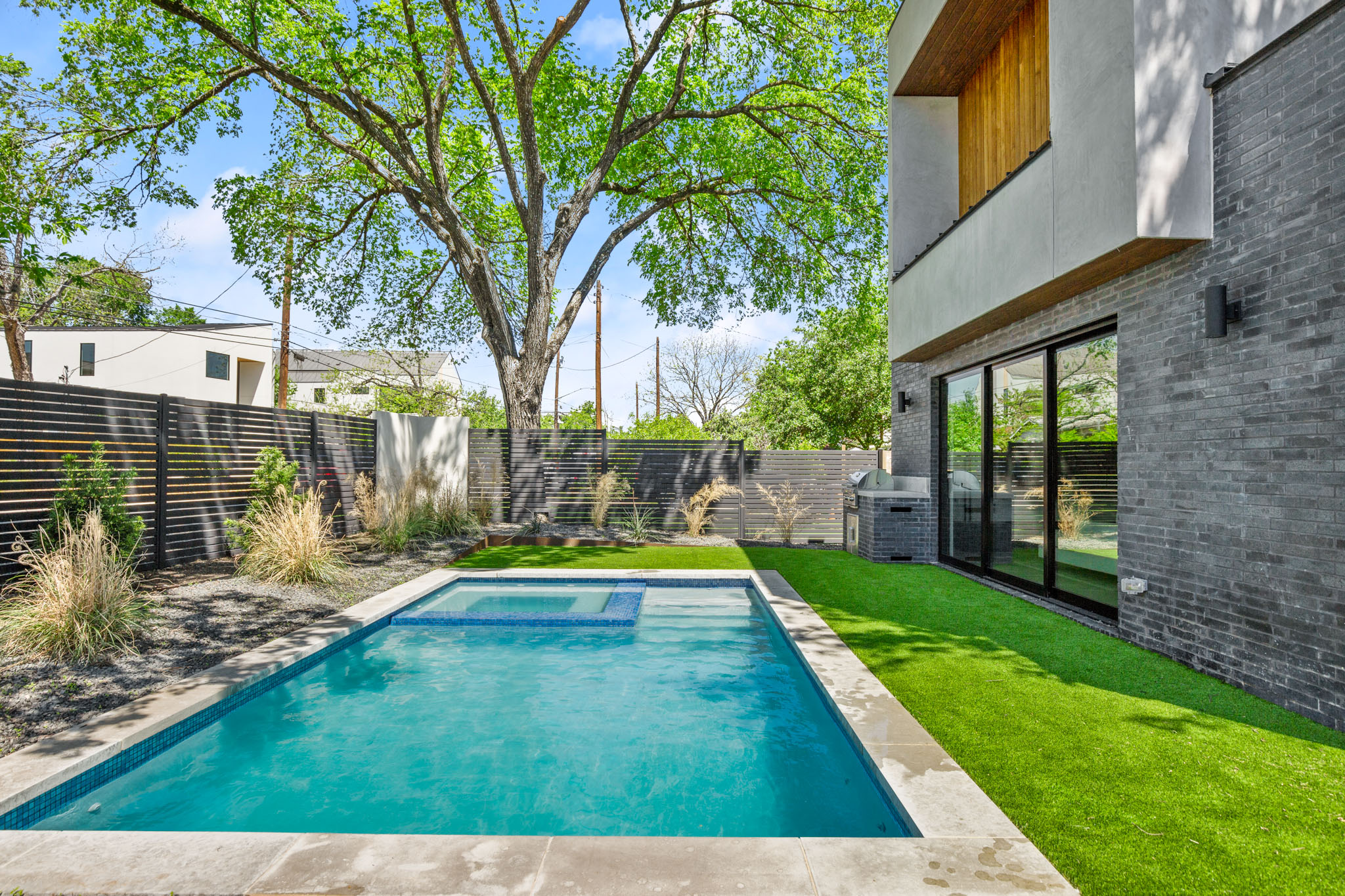 2215 South 3rd Street Austin, TX 78704 - Photo 2 of 38 a view of swimming pool with a backyard and a bench