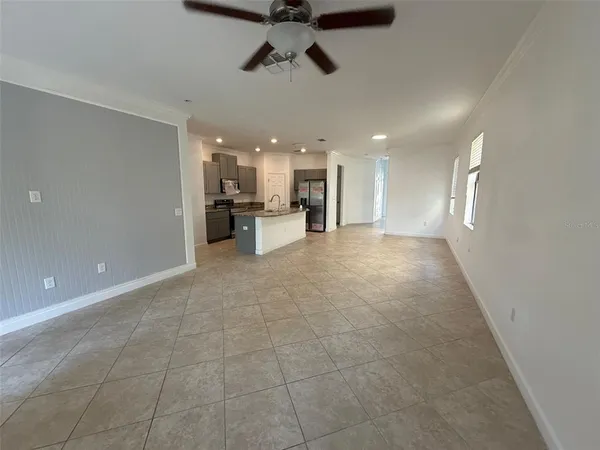 a view of a kitchen with a sink and cabinets