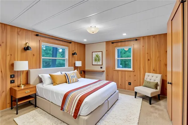 a bedroom with bed and window