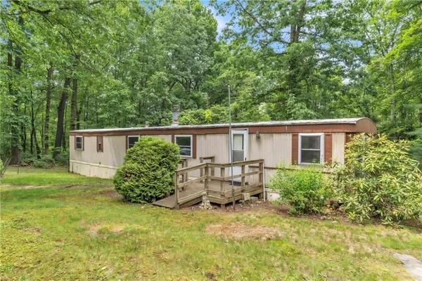 a view of backyard and garden