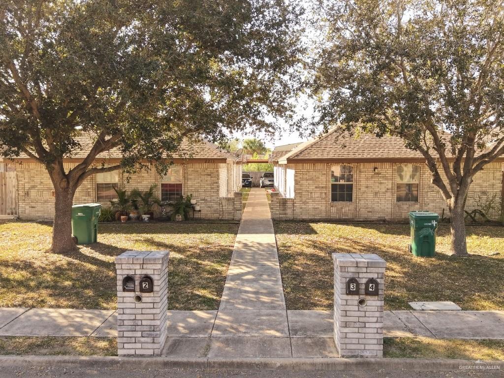2213 North Erica Street Pharr, TX 78577 - Photo 1 of 10 a front view of a house with a yard