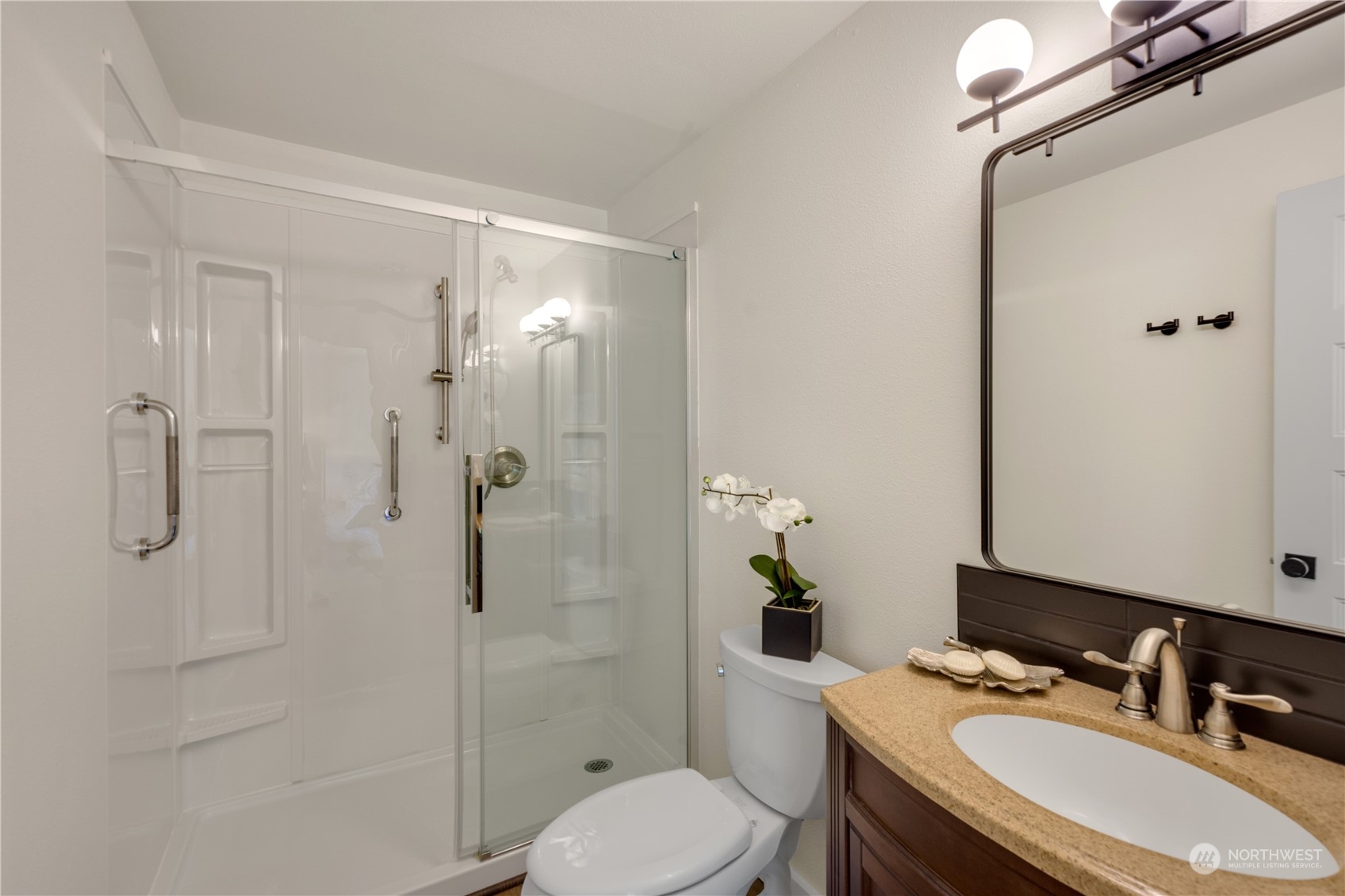 14545 166th Place Southeast Renton, WA 98059 - Photo 16 of 28 a bathroom with a sink toilet and shower
