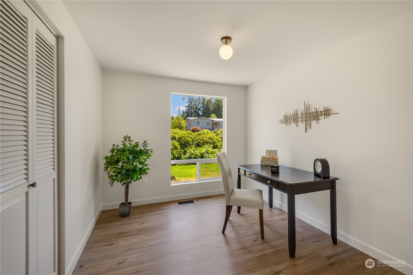 14545 166th Place Southeast Renton, WA 98059 - Photo 22 of 28 a view of a workspace with furniture and a window
