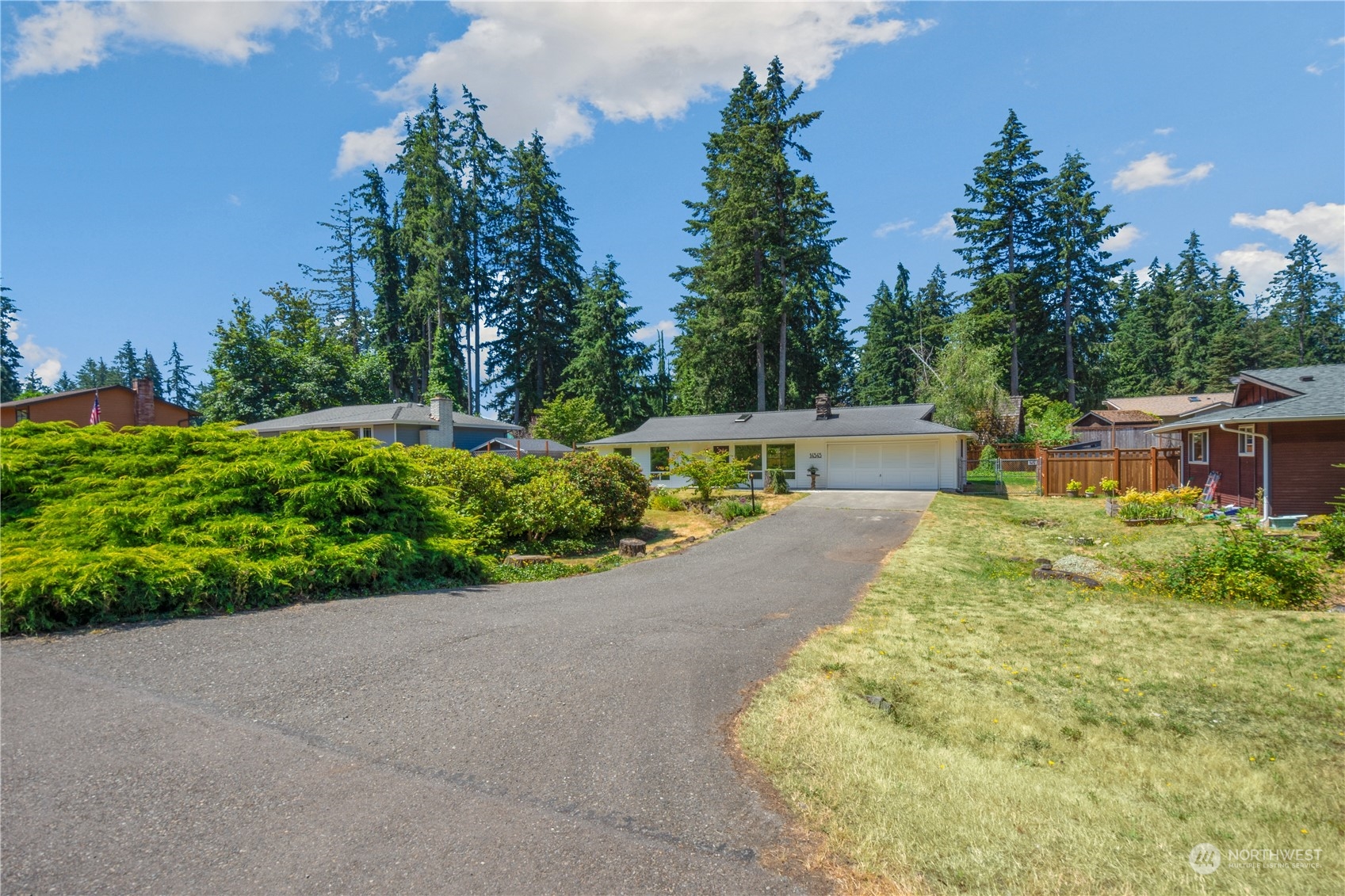 14545 166th Place Southeast Renton, WA 98059 - Photo 27 of 28 a view of yard with swimming pool and green space