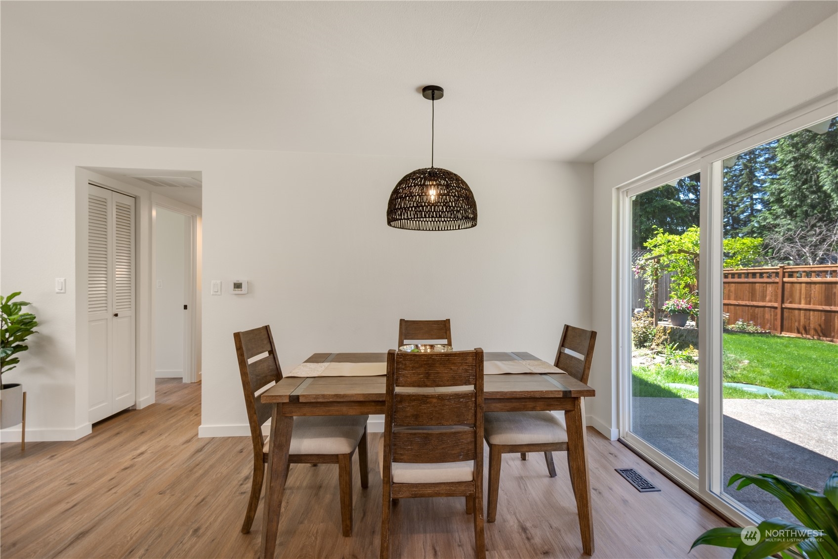 14545 166th Place Southeast Renton, WA 98059 - Photo 8 of 28 a view of a dining room with furniture window and wooden floor
