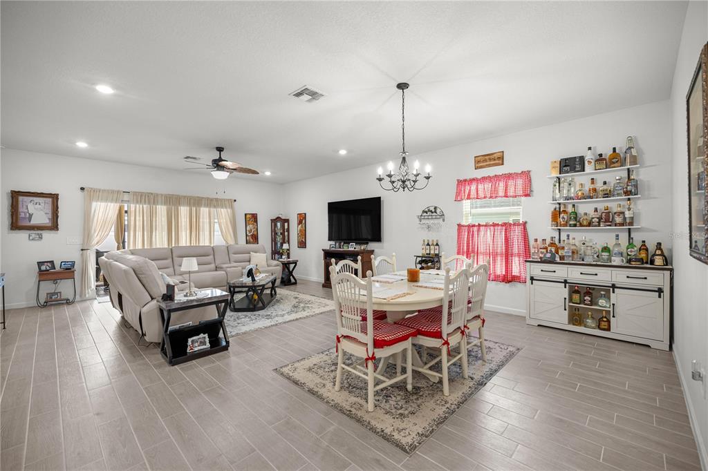 560 Northwest 4th Avenue Williston, FL 32696 - Photo 11 of 31 a living room with furniture and a flat screen tv