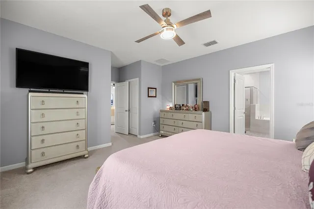 a bed room with a bed and a television